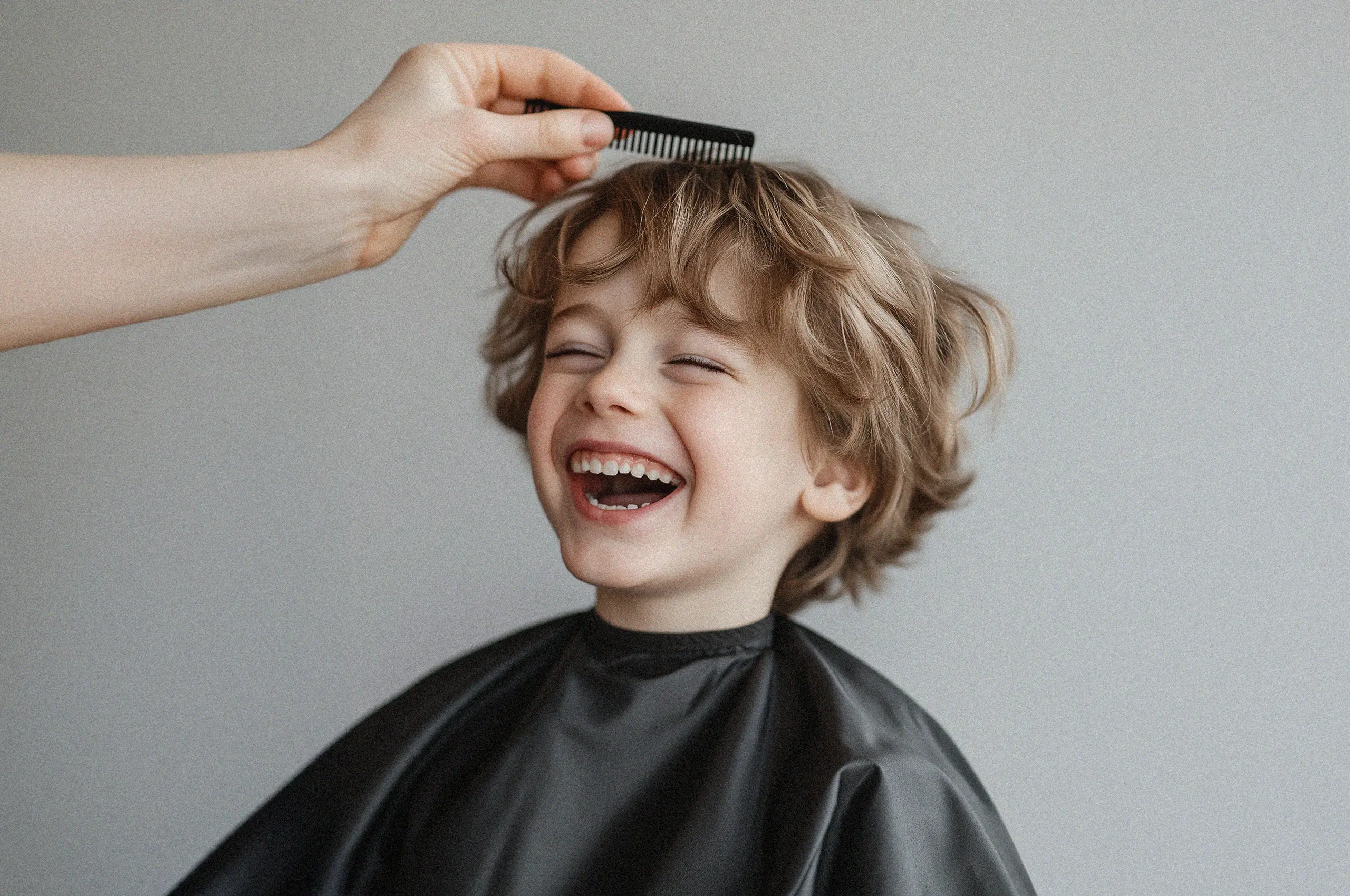 Cannes Image by notthoff La Biosthetique Friseur C Kind Junge lachend auf dem Stuhl